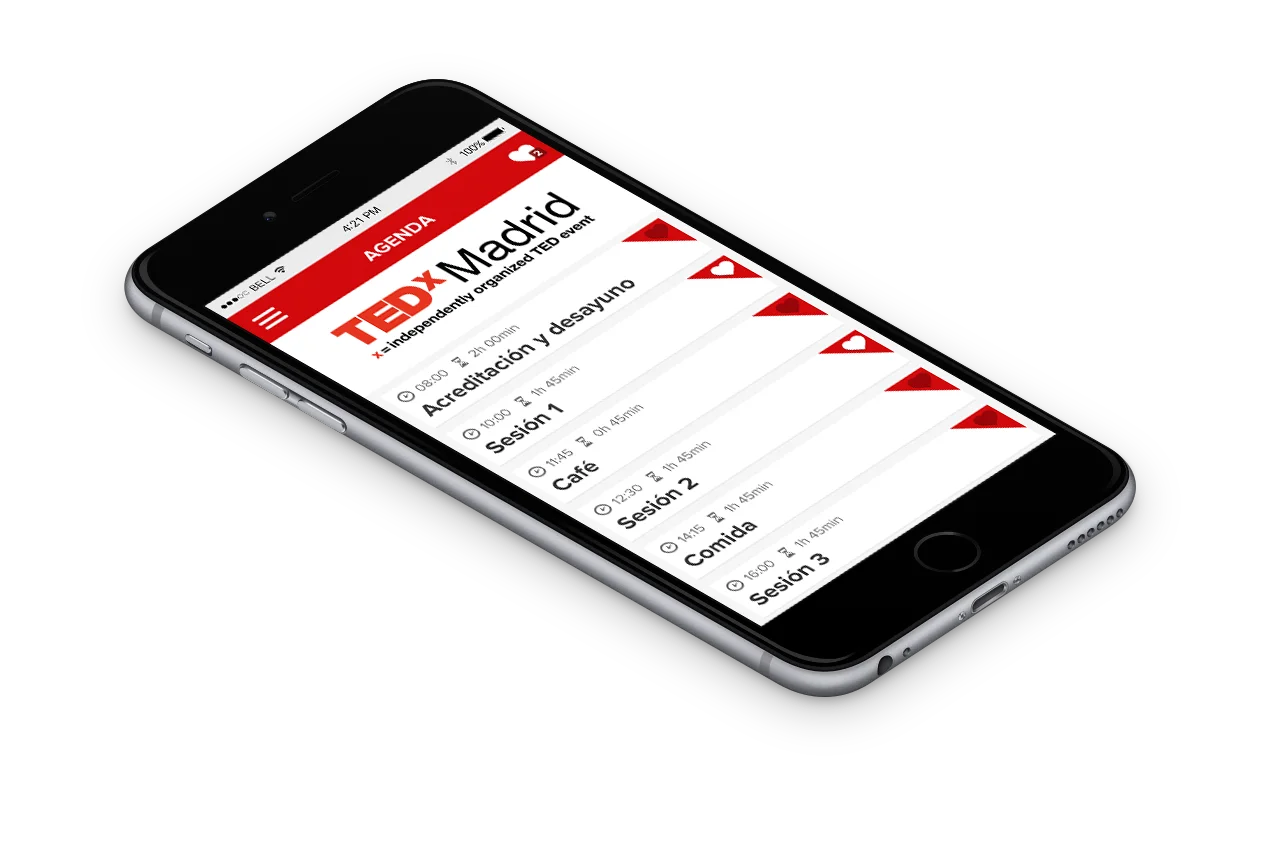 Móvil en perspectiva con la agenda de la jornada TEDxMadrid, listando sesiones y pausas